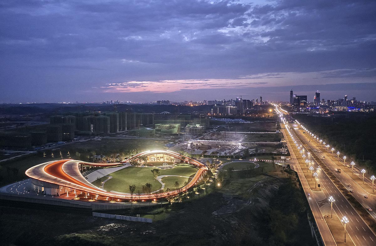 Sinuous red roof combines technology museum and reception center in Chengdu by Powerhouse Company