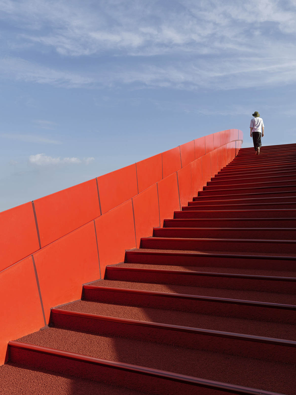 Sinuous red roof combines technology museum and reception center in Chengdu by Powerhouse Company