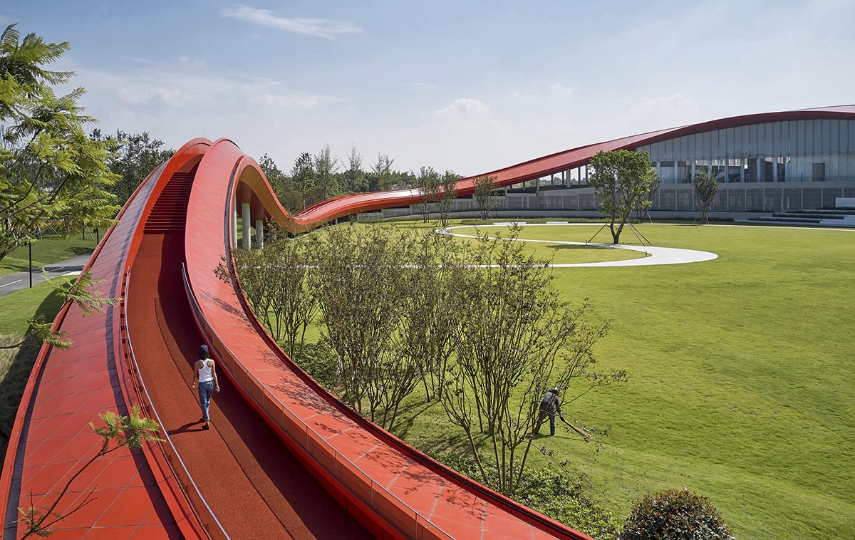 Sinuous red roof combines technology museum and reception center in Chengdu by Powerhouse Company