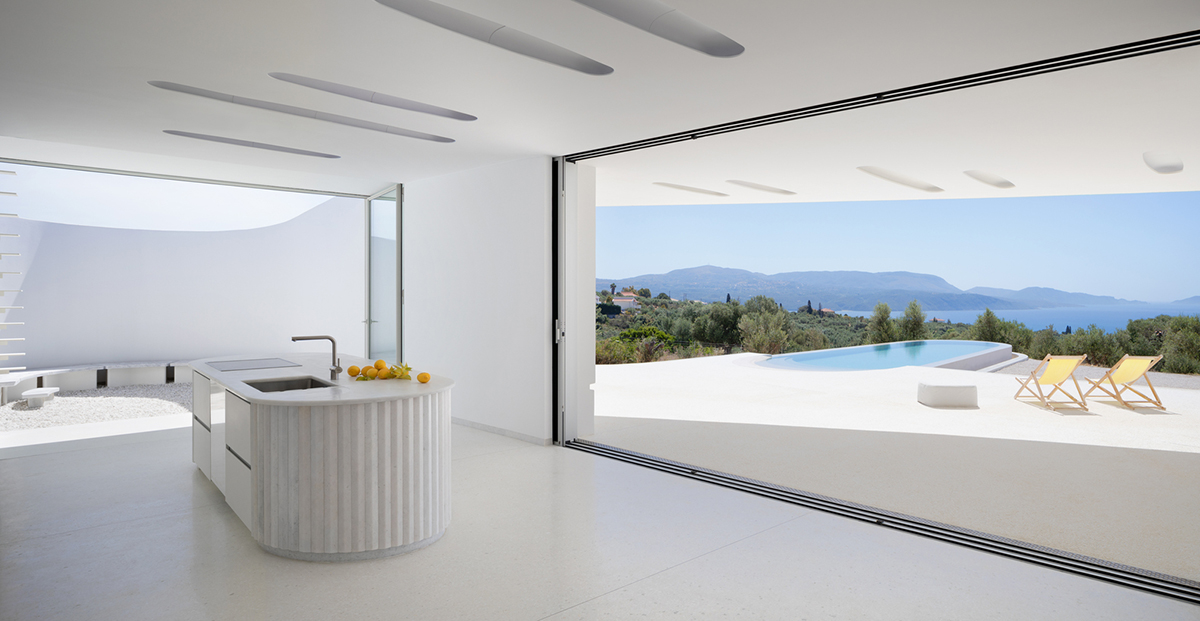 LASSA architects forms rounded walls for house to provide meditative courtyards in Greek olive grove