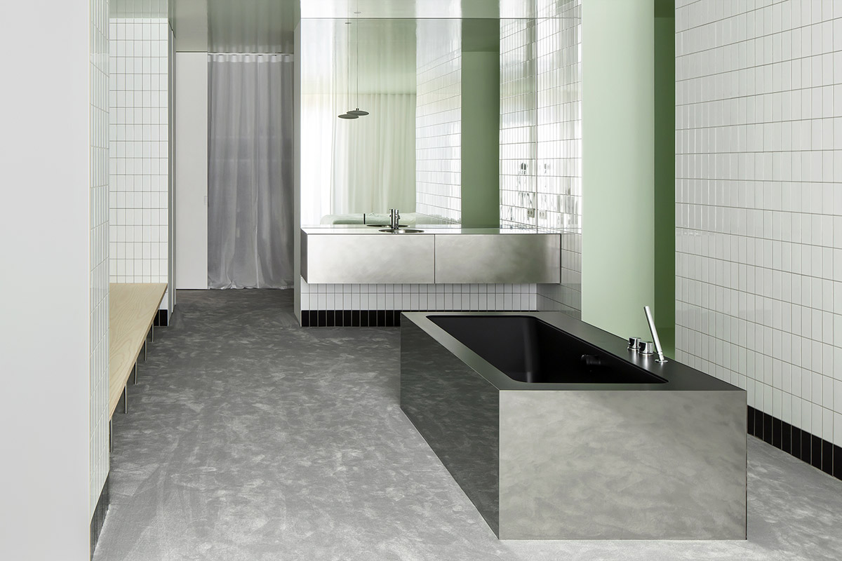 Light green, grey tones and mirrored surfaces dominate interiors of an apartment by Atelier Dialect