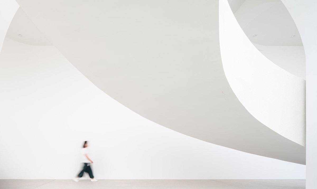 PHTAA creates flexible wedding venue with half-arch modular elements and white curved walls