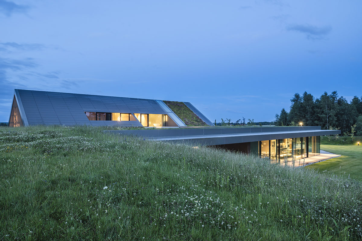 Private house by Mobius Architekci pretends to be erected from the landscape in Poland