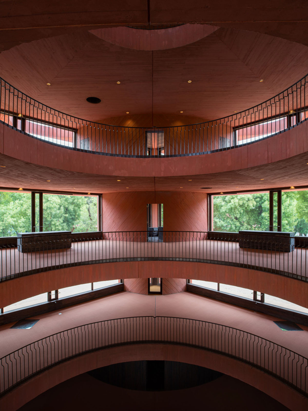 Red pigmented curved walls create 