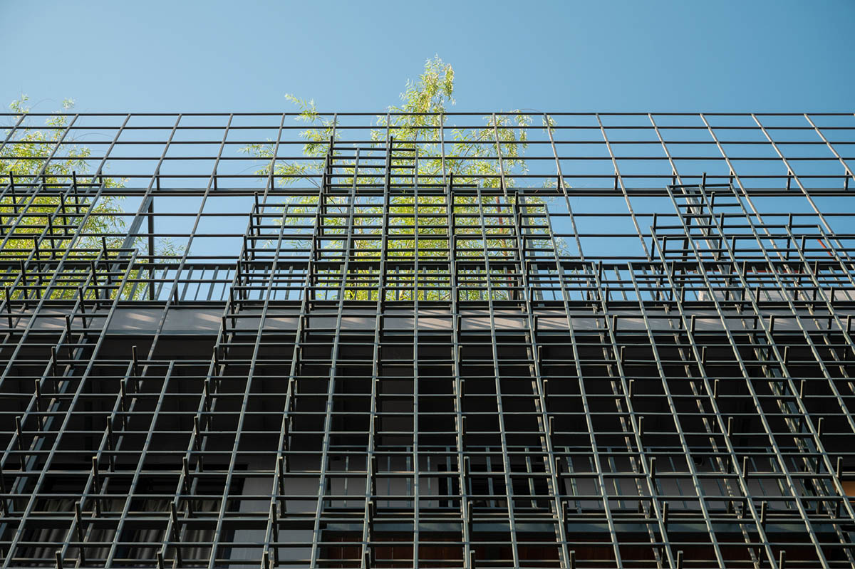 SIM Studio converts old shophouse into a boutique hotel by wrapping with steel exoskeleton in Bangkok