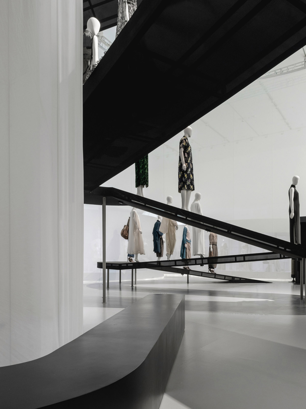 Studio 10 designs exhibition space with white tubular structures and black translucent ramps in China