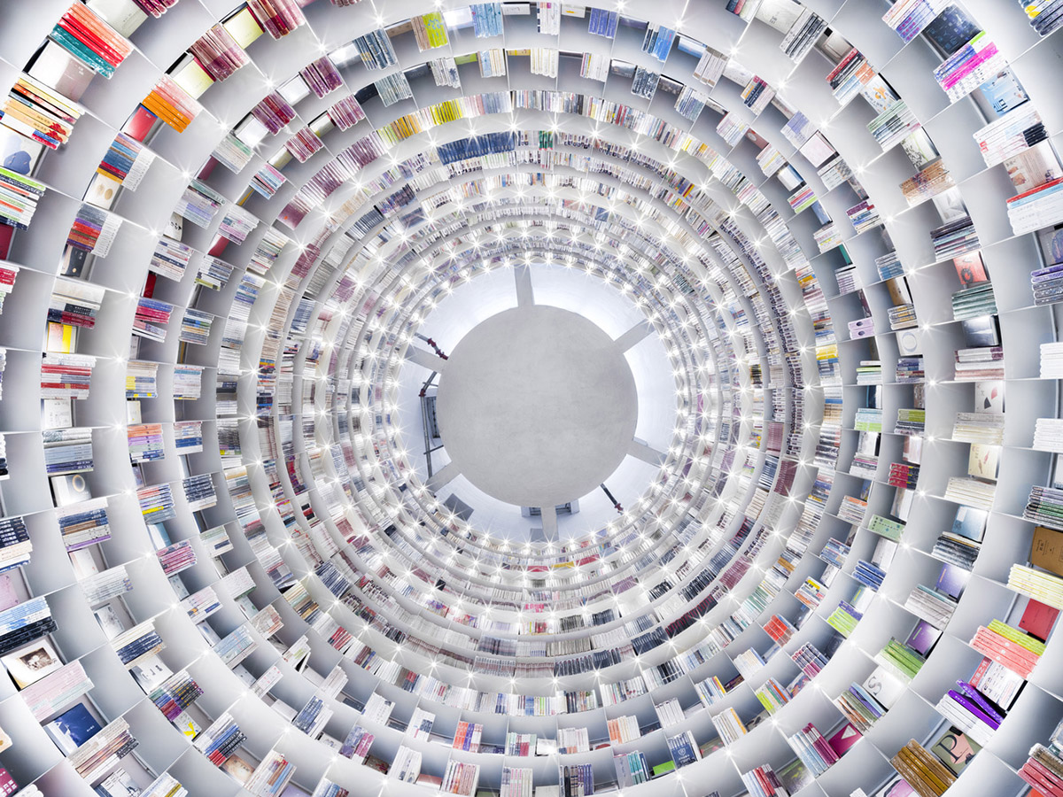 Ten towering cylindrical cement silos are converted to house immersive library of books in China