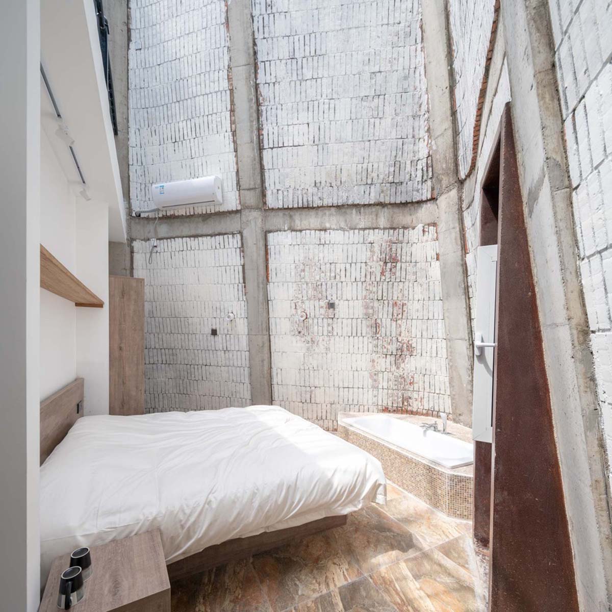 Hyperbolic vertical grottos are activated by a network of floating wooden bridges in China