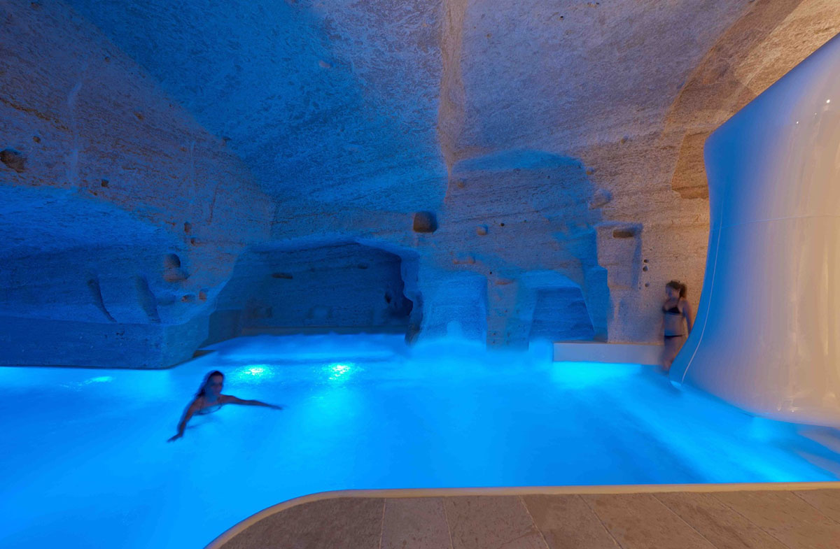 Interiors of this cave hotel and spa by Simone Micheli act like work of art with excavated surfaces