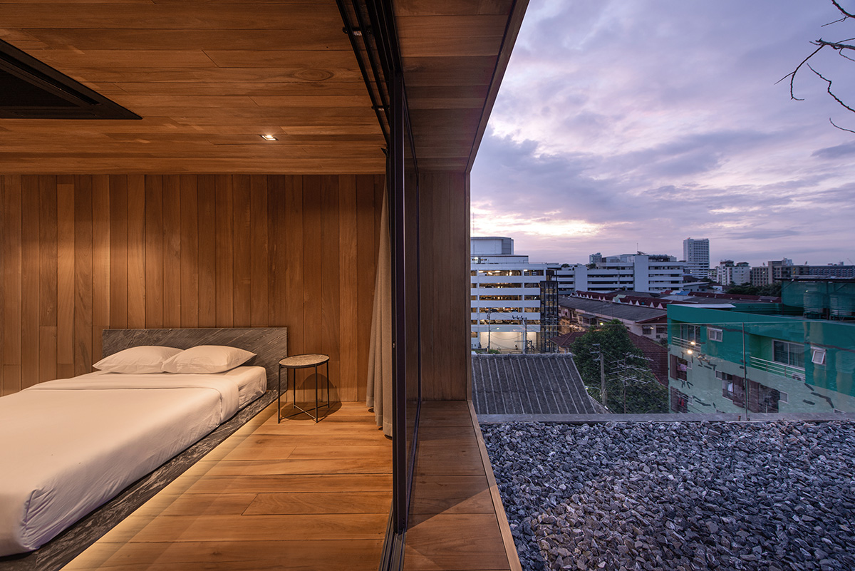 WARchitect built a borderless wooden residence on rooftop in Bangkok