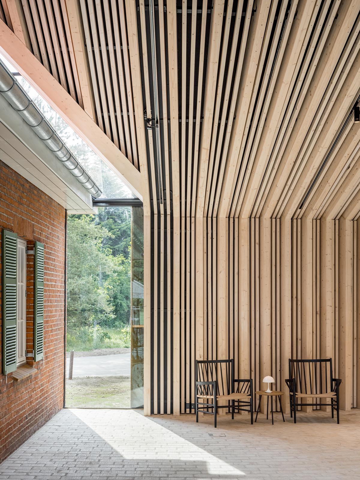BIG completes new refugee museum in Denmark with soft curve corten steel volume