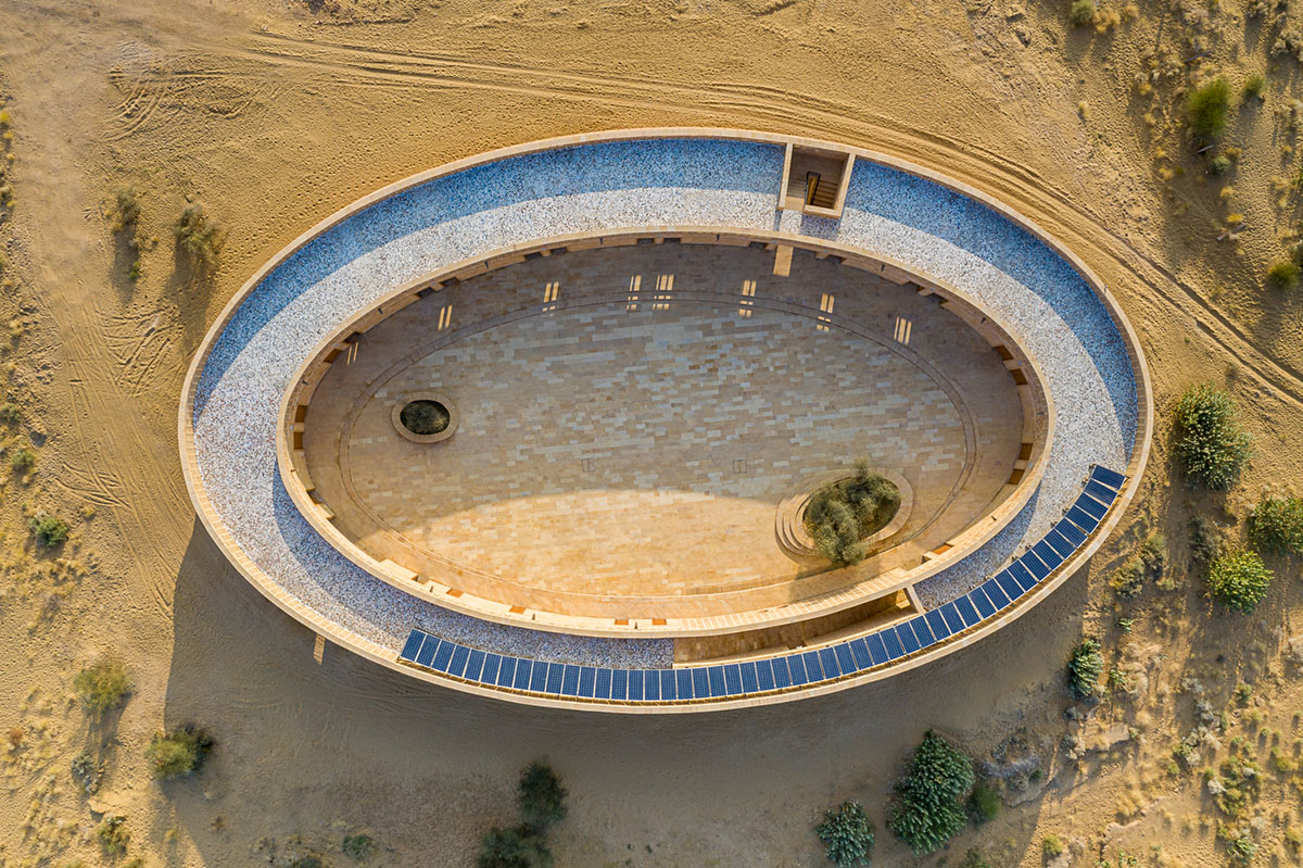 Diana Kellogg Architects' oval-shaped girl's school is made of hand-carved sandstone in rural India