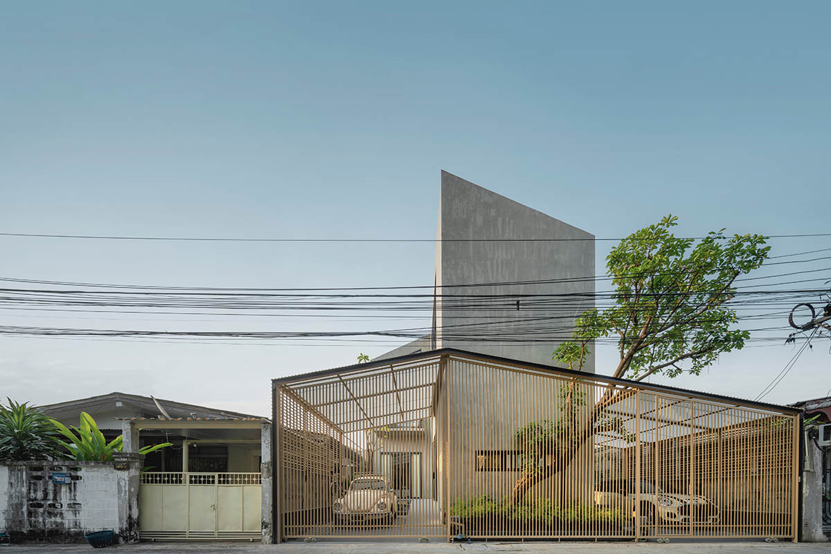 AUN Design Studio adds steel fence to private home for airy entrance in Bangkok