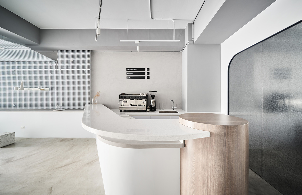 Republic Design reveals its coffee shop and gallery with curvy and white elements in Taiwan