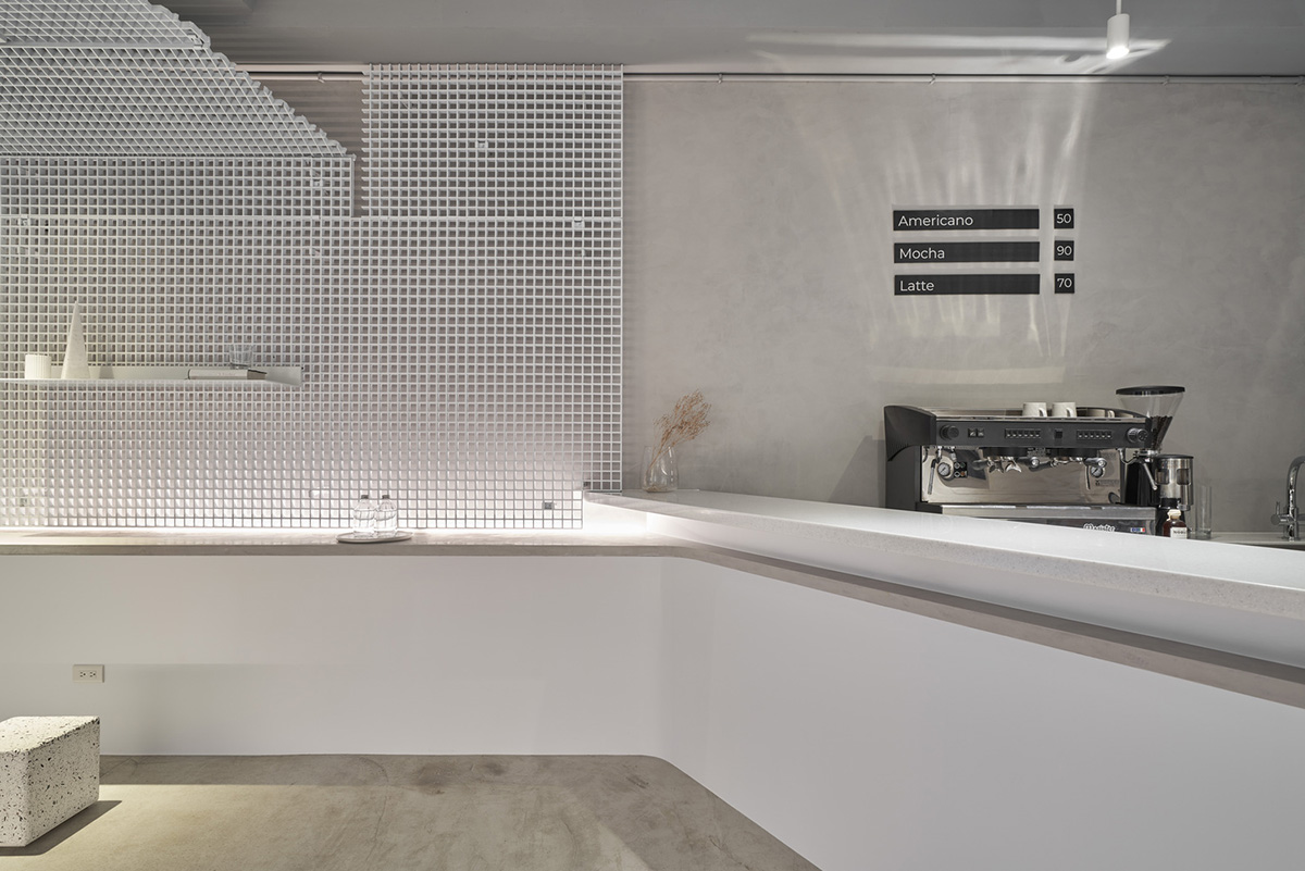 Republic Design reveals its coffee shop and gallery with curvy and white elements in Taiwan