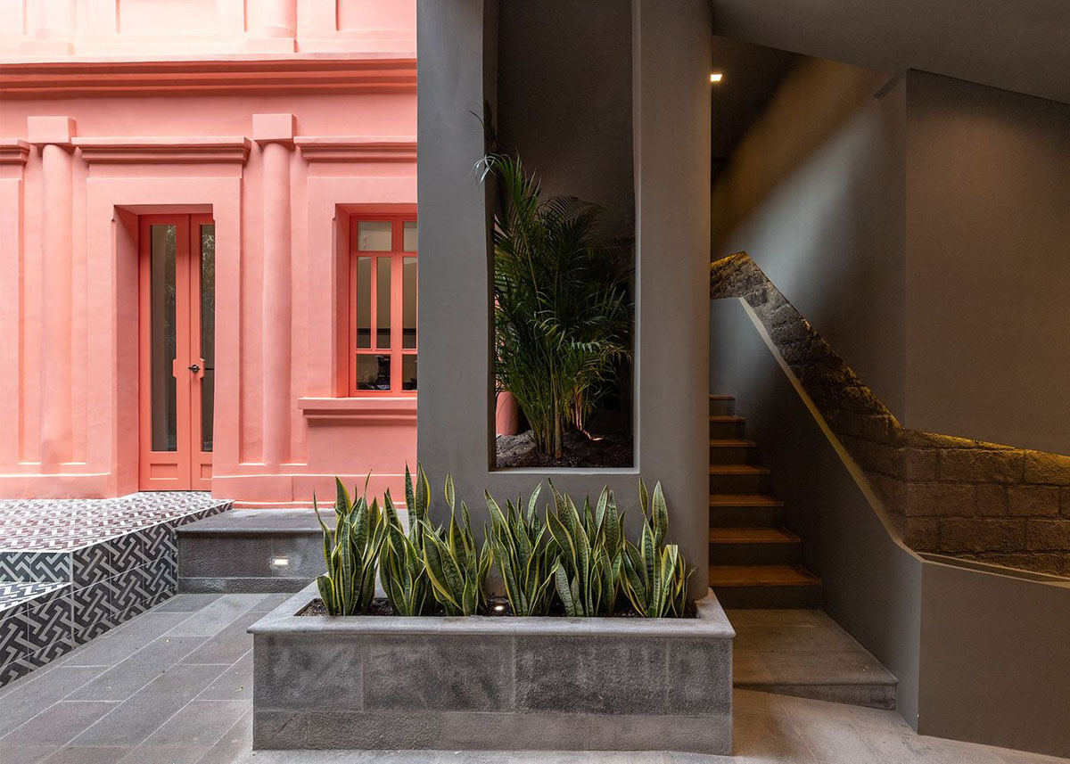 nicolas&nicolas converts old building into hotel with pinkish walls and central courtyard in Quito