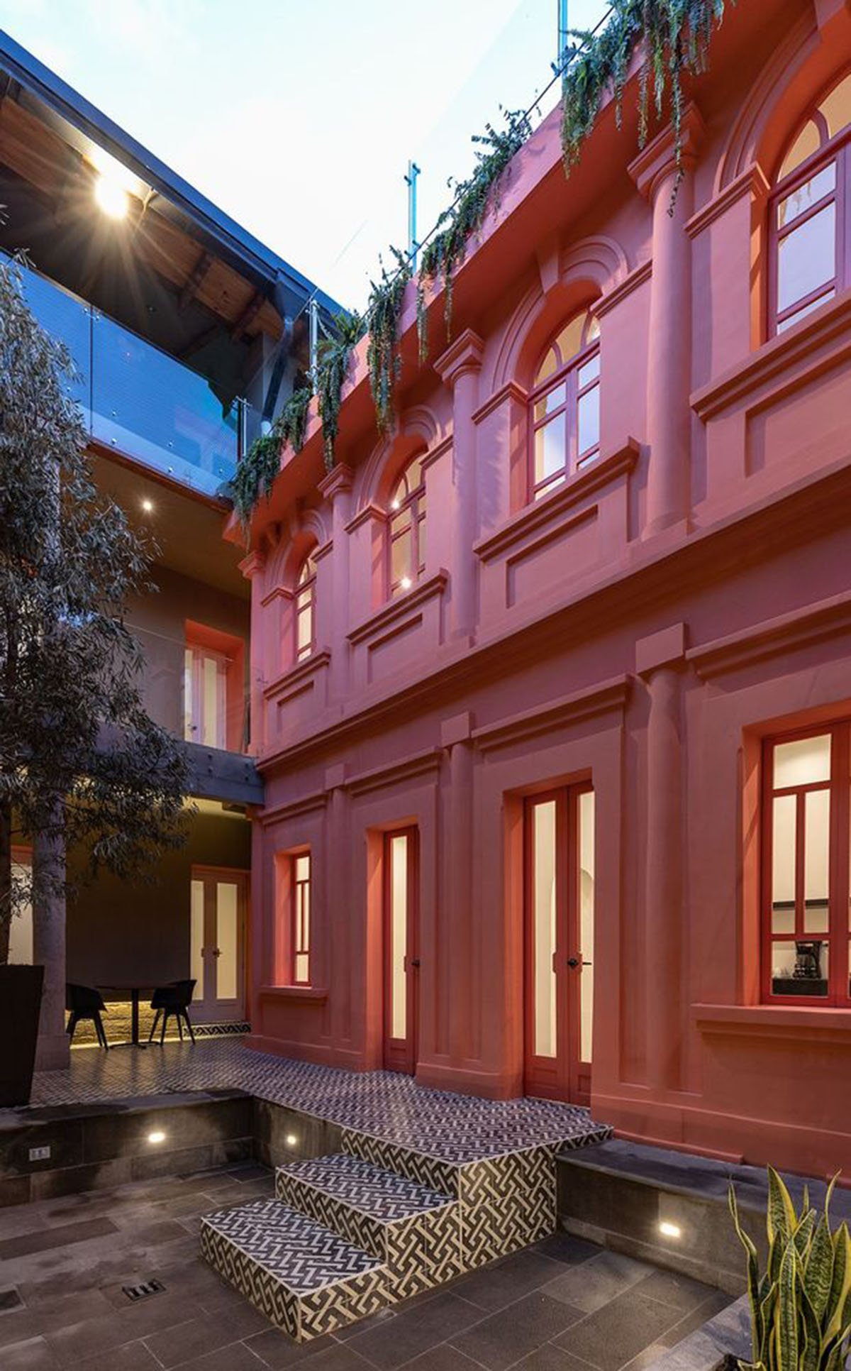 nicolas&nicolas converts old building into hotel with pinkish walls and central courtyard in Quito
