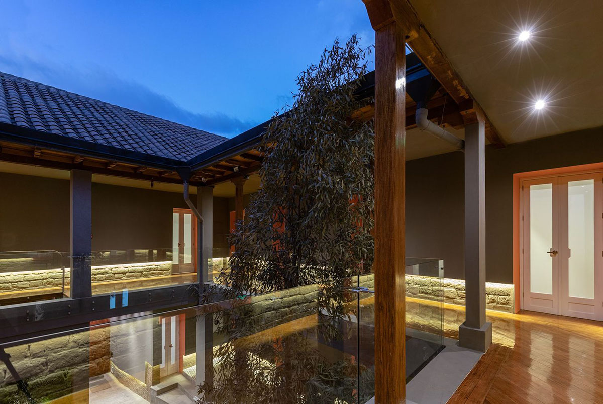 nicolas&nicolas converts old building into hotel with pinkish walls and central courtyard in Quito