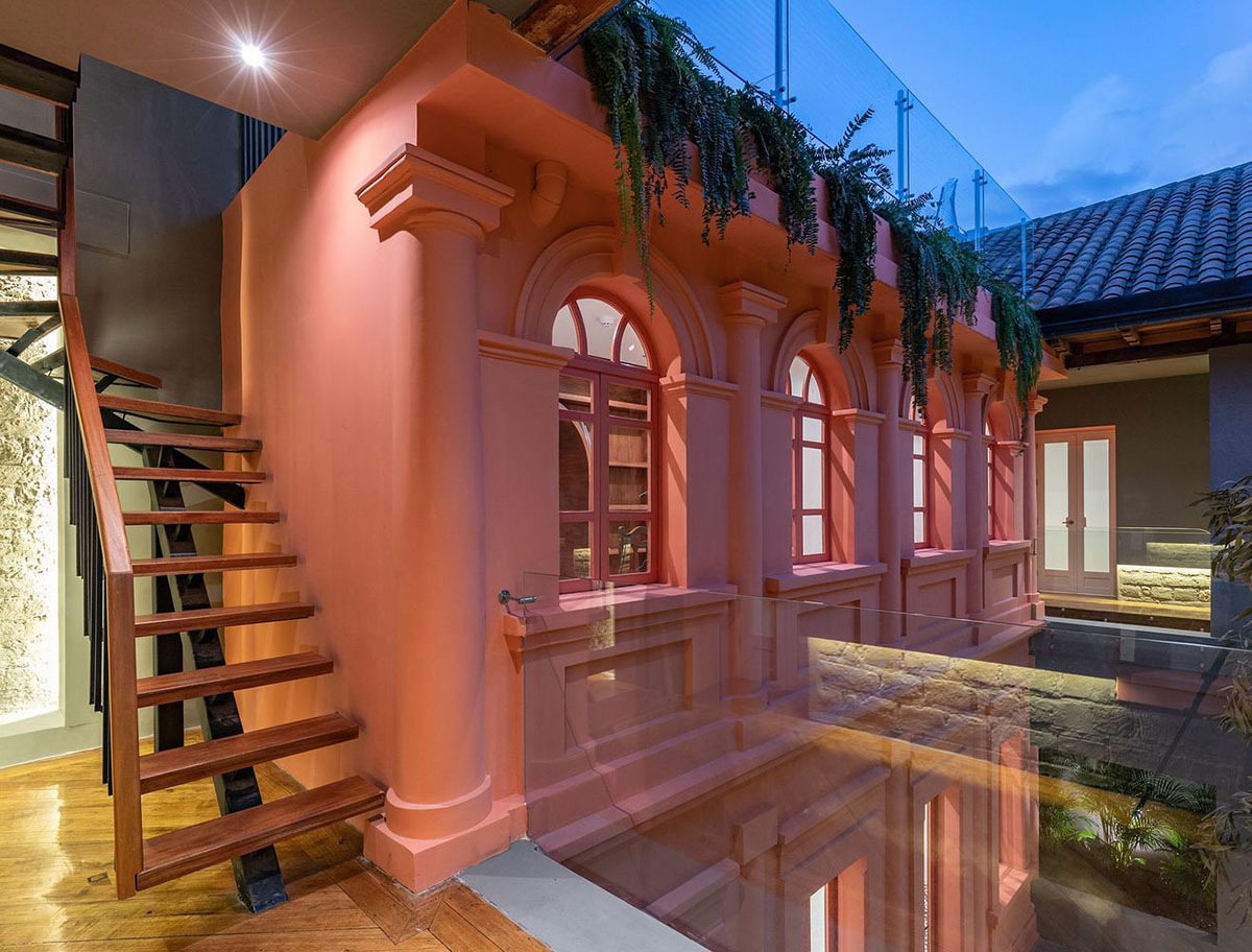 nicolas&nicolas converts old building into hotel with pinkish walls and central courtyard in Quito