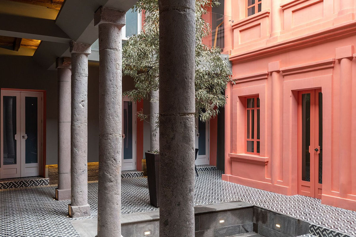 nicolas&nicolas converts old building into hotel with pinkish walls and central courtyard in Quito