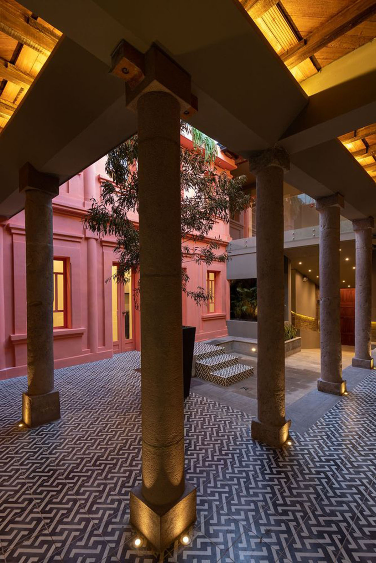 nicolas&nicolas converts old building into hotel with pinkish walls and central courtyard in Quito