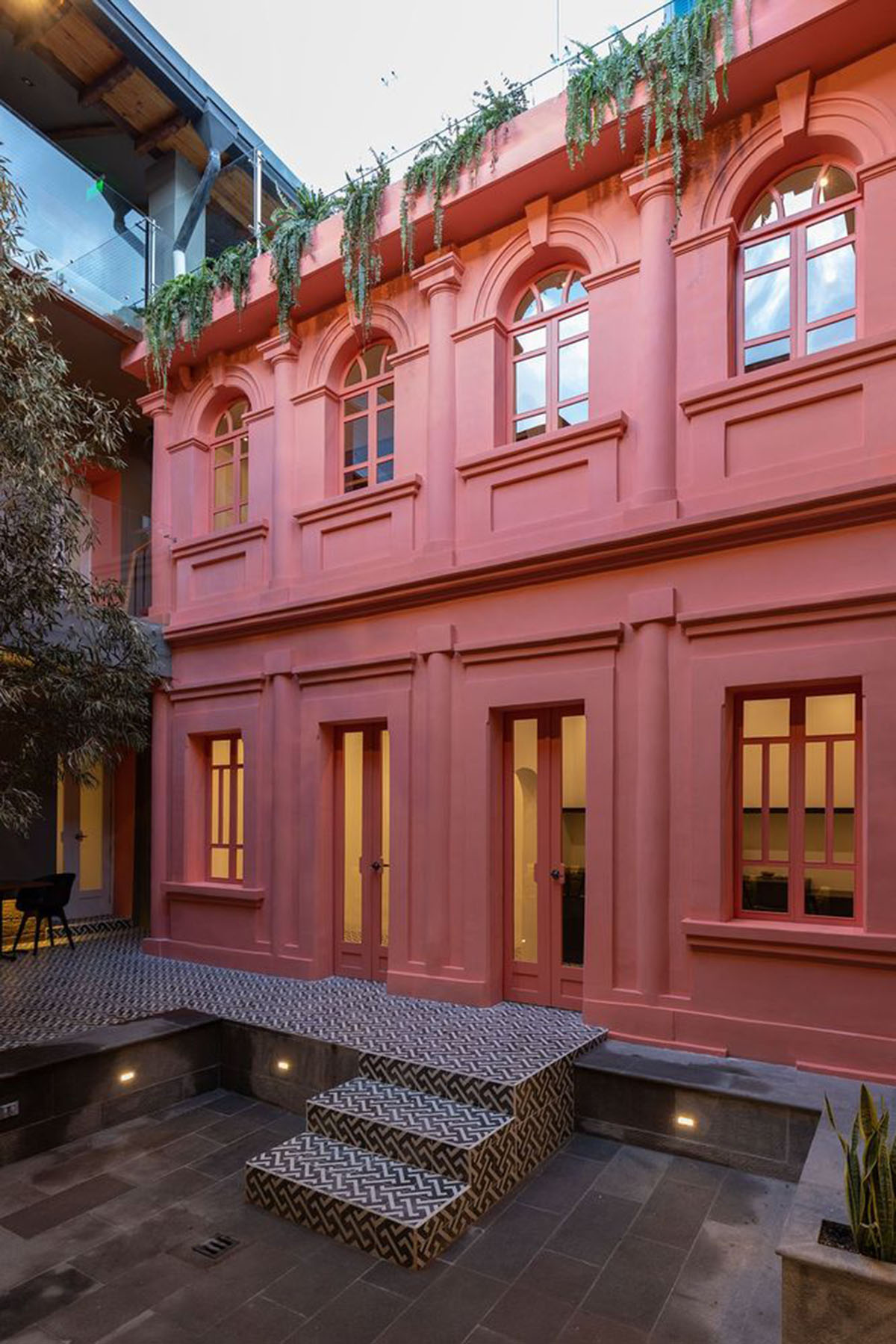 nicolas&nicolas converts old building into hotel with pinkish walls and central courtyard in Quito
