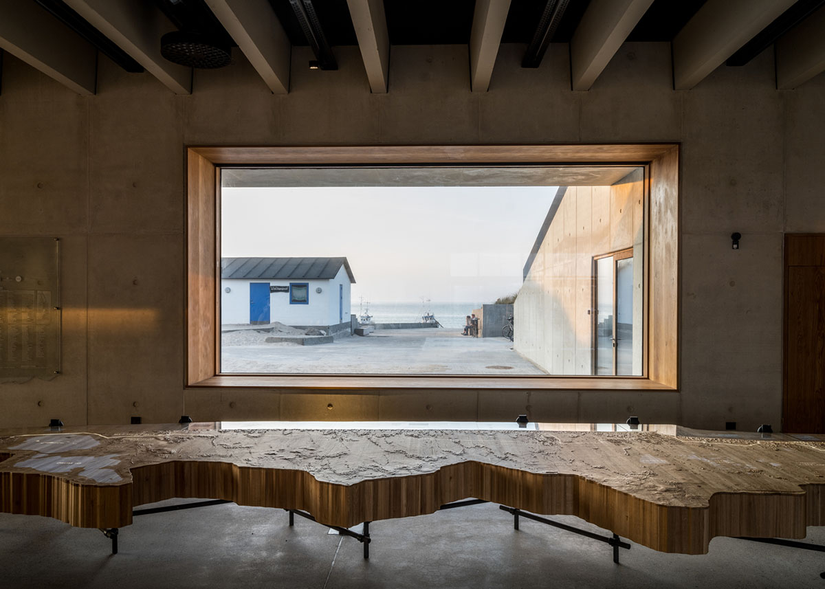 LOOP Architects embeds visitor center into existing dune landscape creating natural hill in Denmark 