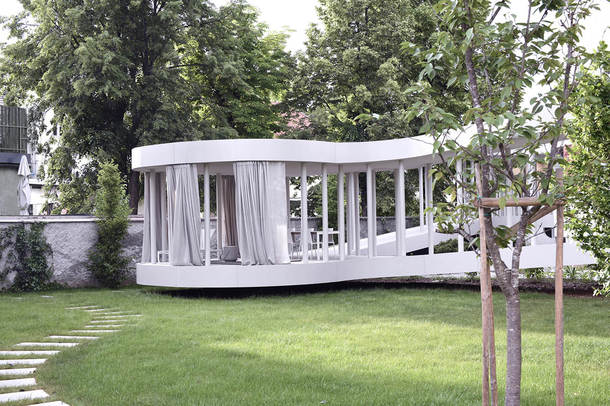 OFIS Architects renovates 1930s house with colonnaded and sloped pavilion in Slovenia 