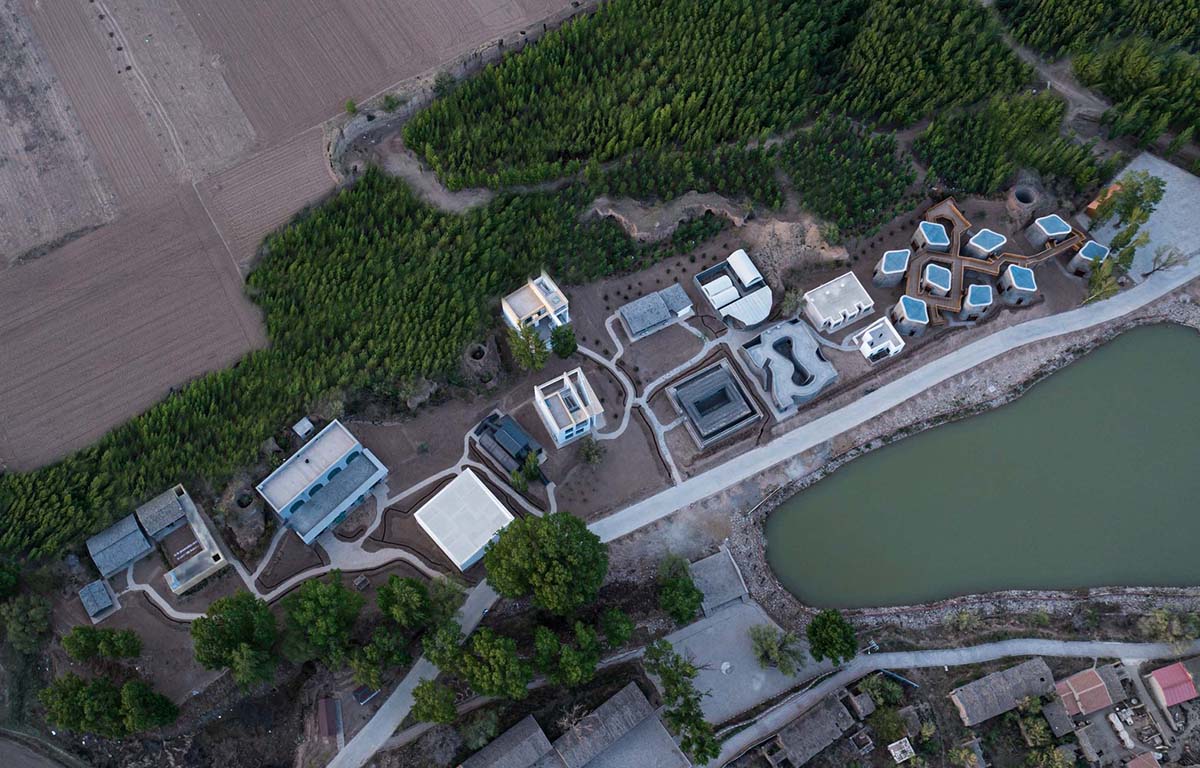 Hyperbolic vertical grottos are activated by a network of floating wooden bridges in China