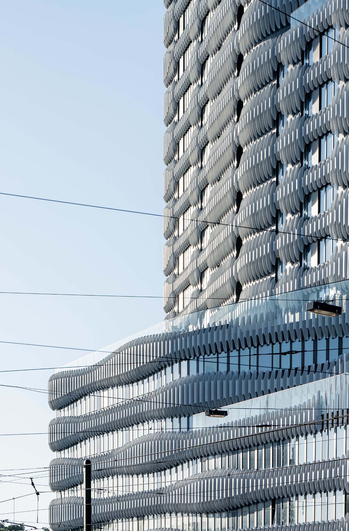 Mixed-used high-rise by J. Mayer H. is dressed with zipper