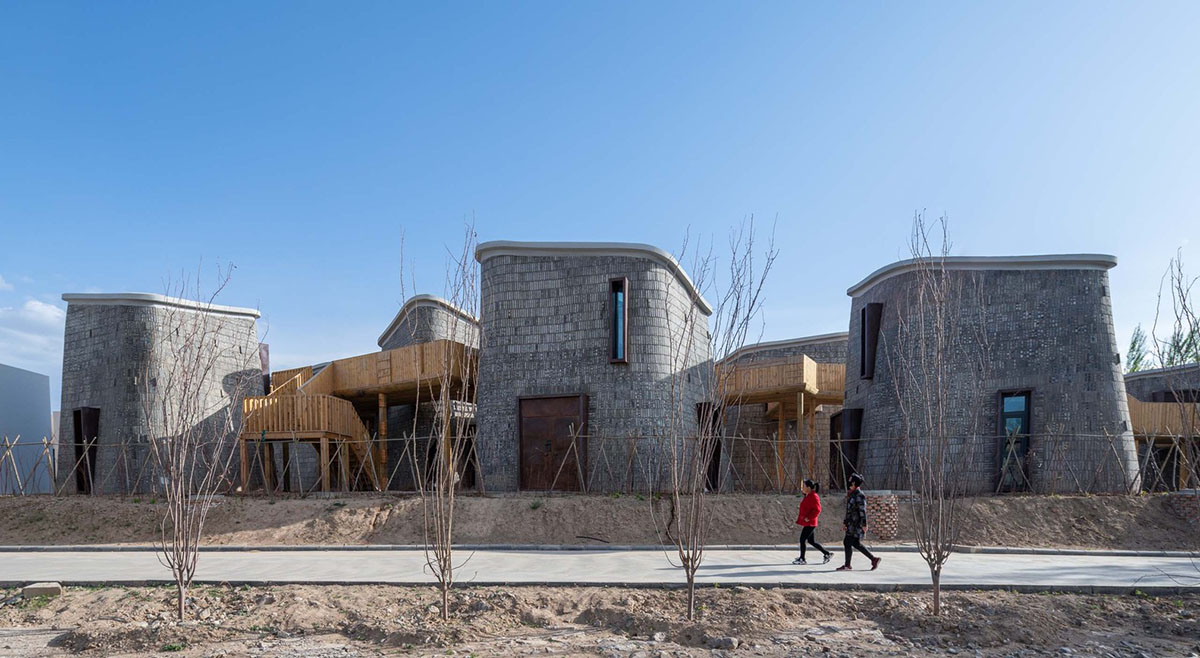 Hyperbolic vertical grottos are activated by a network of floating wooden bridges in China