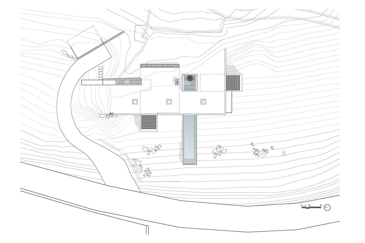 Swimming pool is bravely extended from inside of this concrete house towards endless view in Tinos