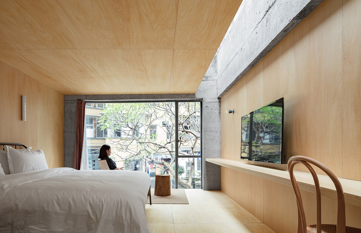 kooo architects designed warm interior space for young travelers for this guesthouse in Guangzhou