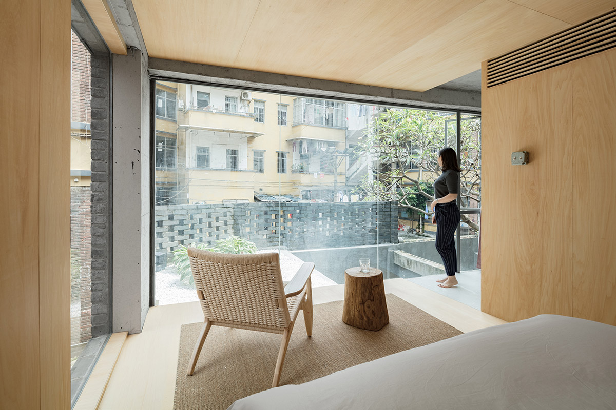 kooo architects designed warm interior space for young travelers for this guesthouse in Guangzhou