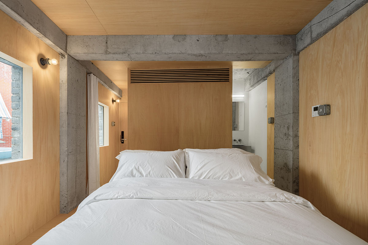kooo architects designed warm interior space for young travelers for this guesthouse in Guangzhou