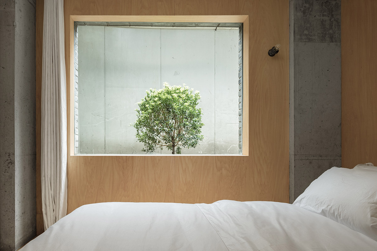 kooo architects designed warm interior space for young travelers for this guesthouse in Guangzhou