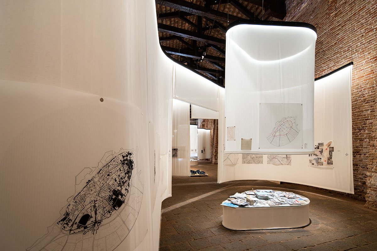 Kuwait Pavilion suspends curved fabrics investigatig effects of Kuwait's modernist urban planning 