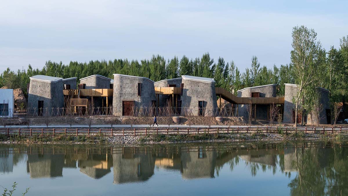 Hyperbolic vertical grottos are activated by a network of floating wooden bridges in China