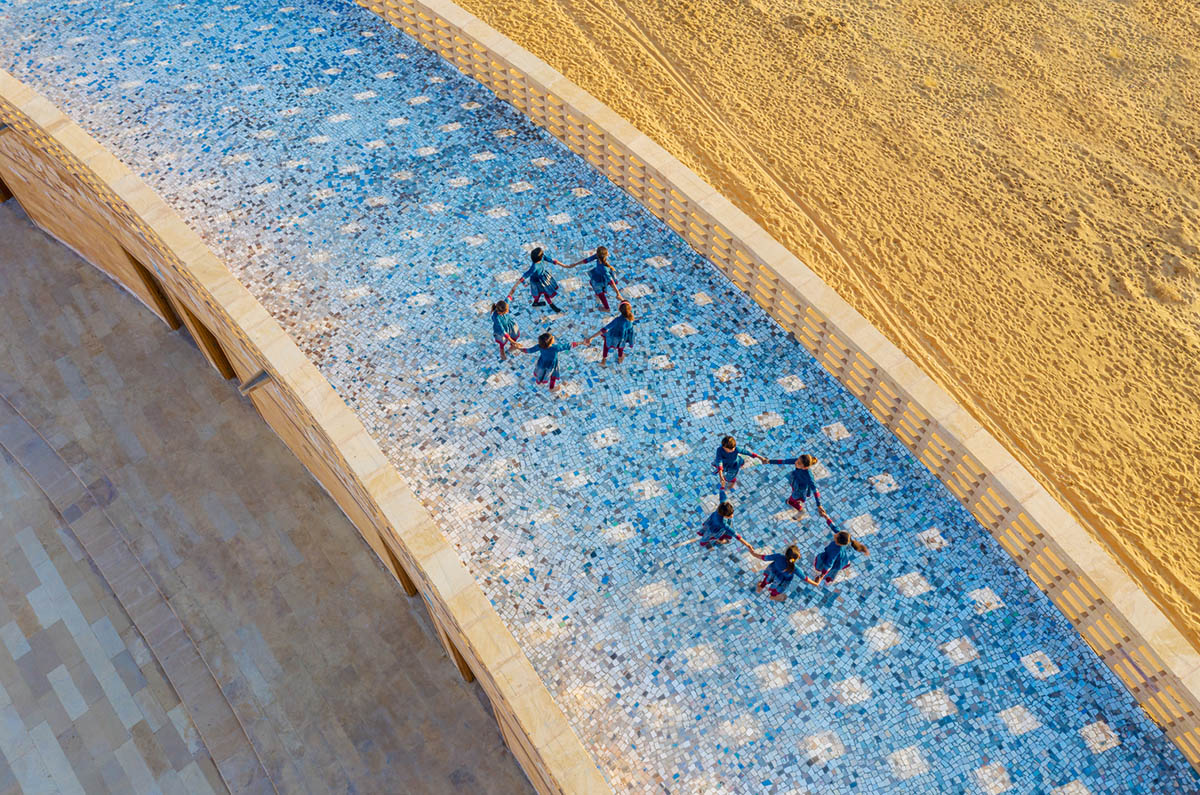 Diana Kellogg Architects' oval-shaped girl's school is made of hand-carved sandstone in rural India