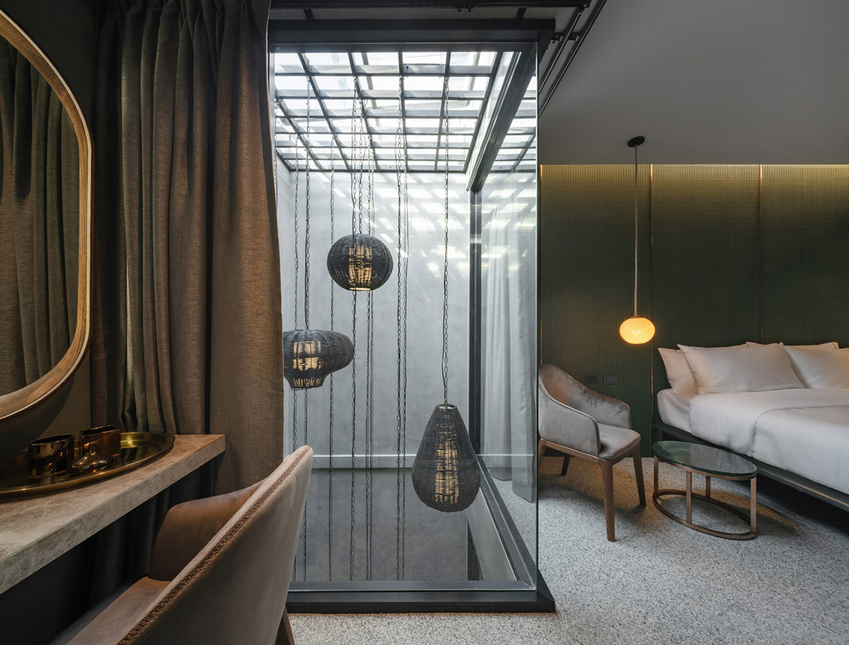 SIM Studio converts old shophouse into a boutique hotel by wrapping with steel exoskeleton in Bangkok