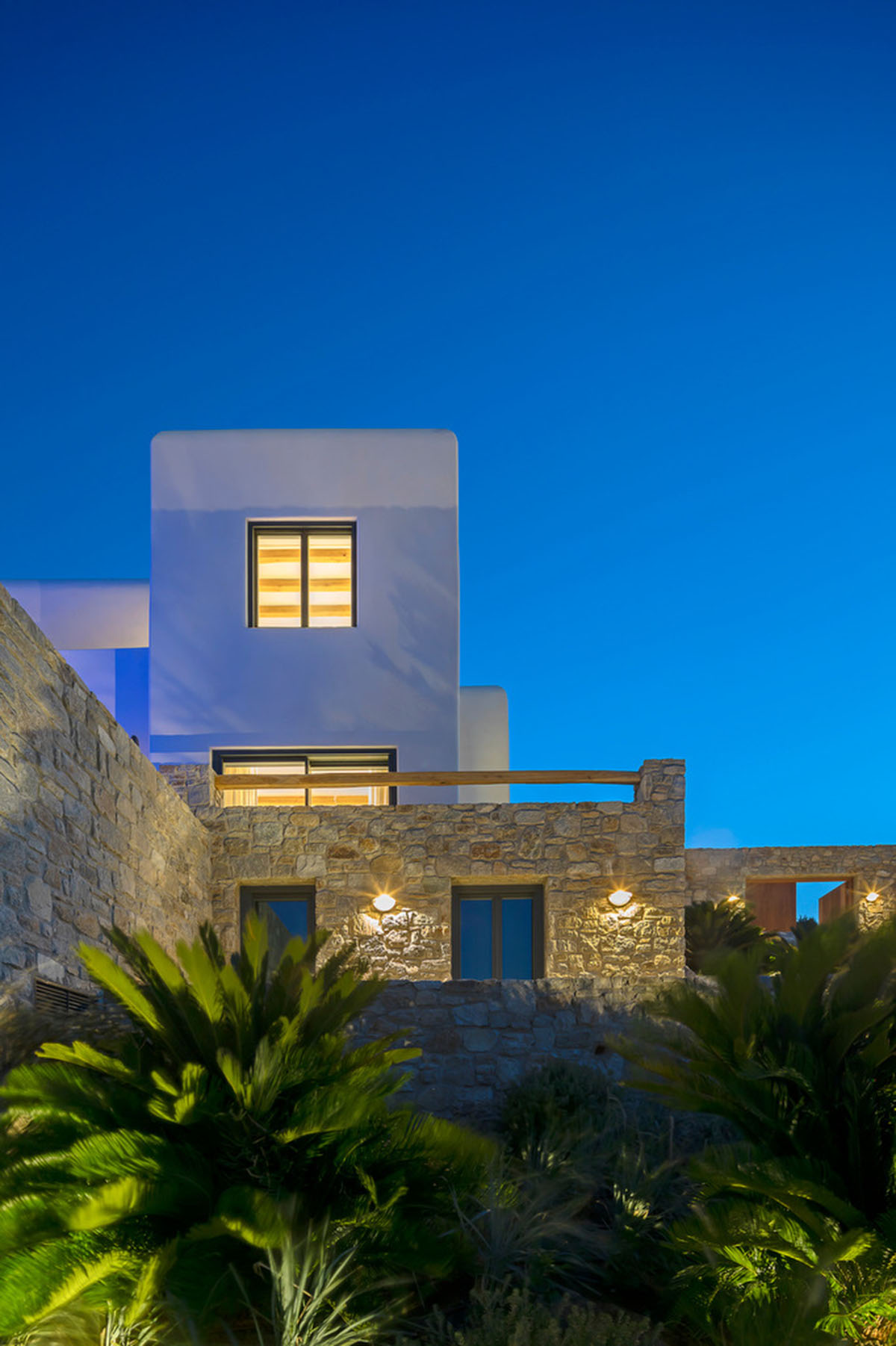 MK Design Studio designs luxurious holiday villa with creamy white walls and stone-walled terraces