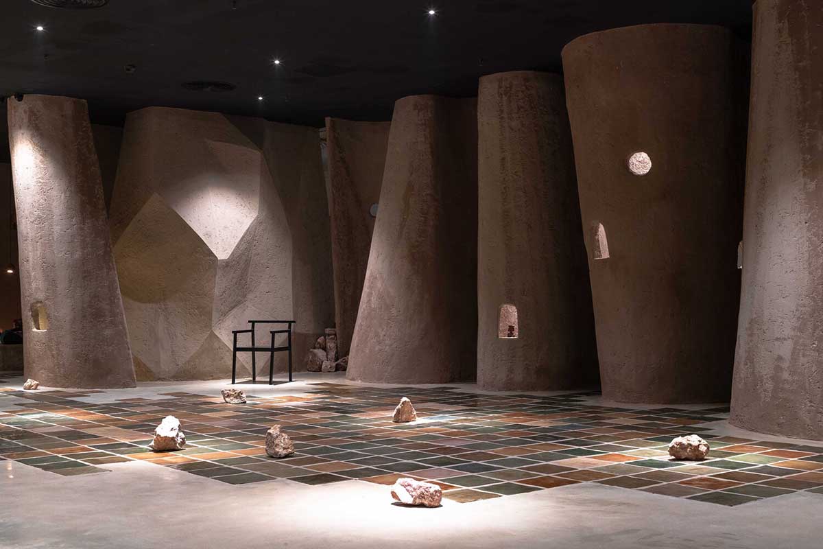 Vegetarian restaurant by Adrei Studio features moulded walls that become exhibition piece in Vietnam 