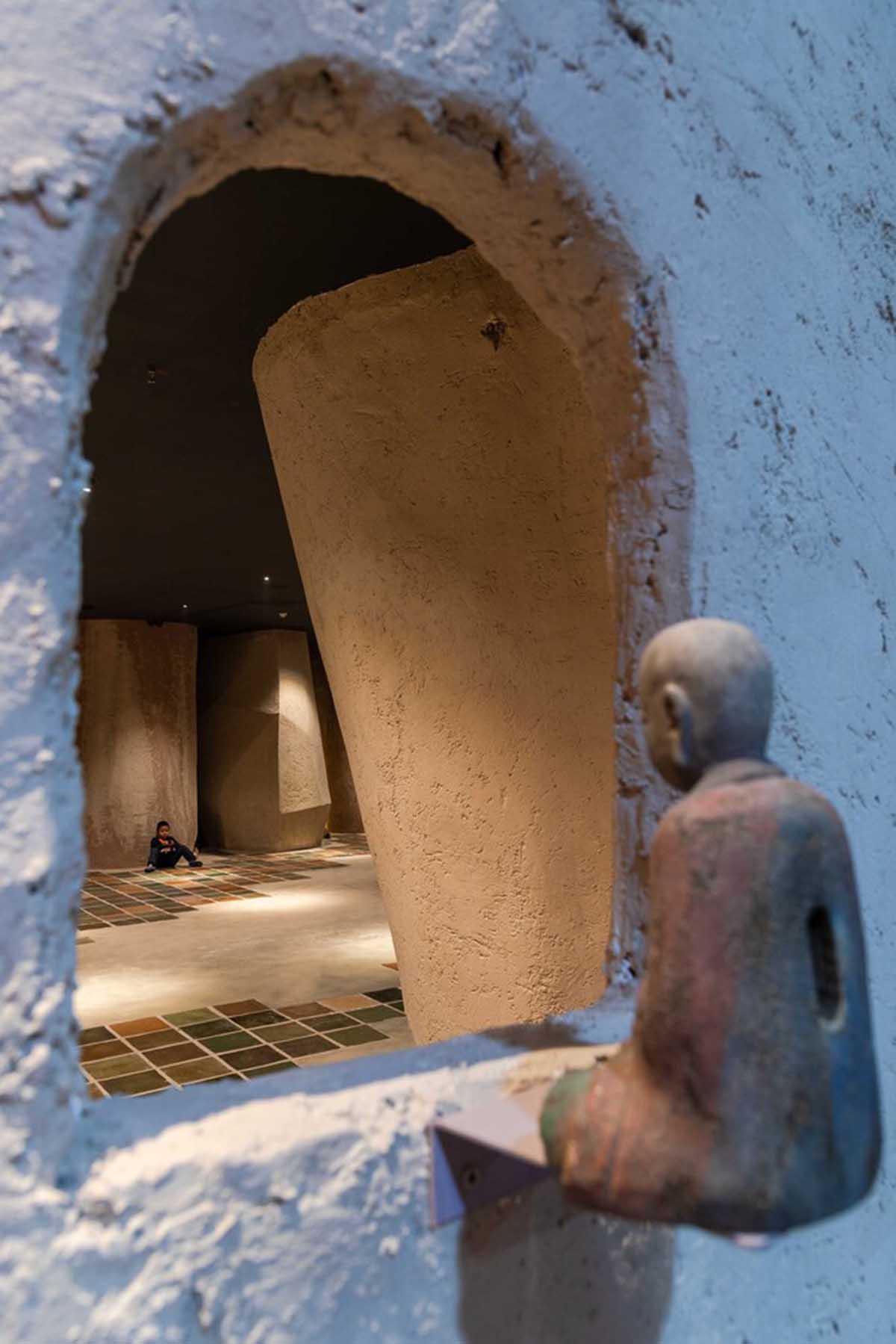 Vegetarian restaurant by Adrei Studio features moulded walls that become exhibition piece in Vietnam 