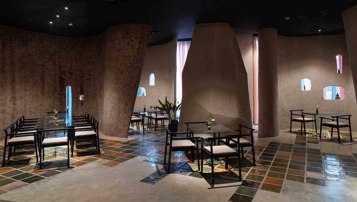 Vegetarian restaurant by Adrei Studio features moulded walls that become exhibition piece in Vietnam 