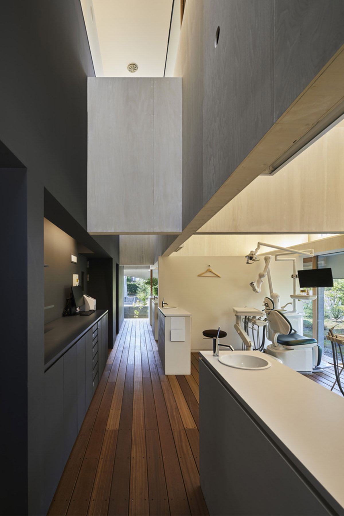 A dental clinic and daycare center are hidden under arches in Japan by Takeru Shoji Architects