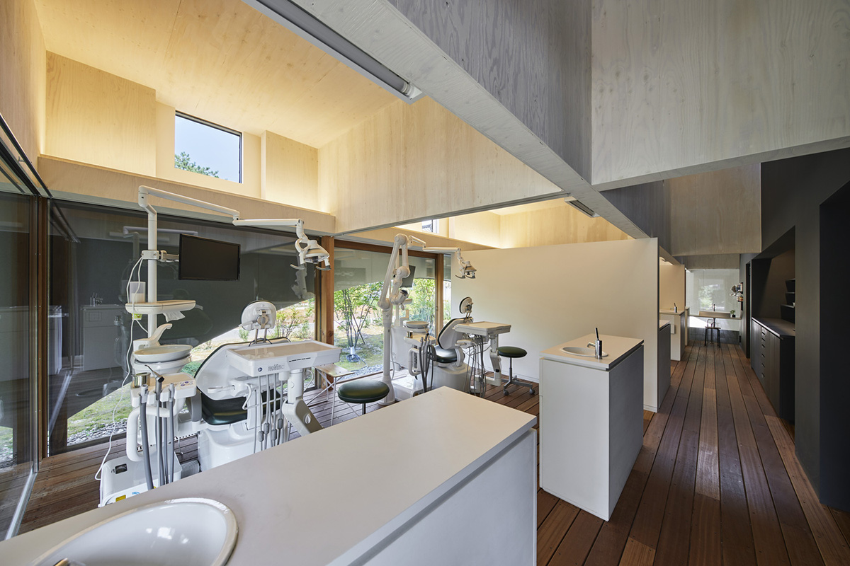 A dental clinic and daycare center are hidden under arches in Japan by Takeru Shoji Architects