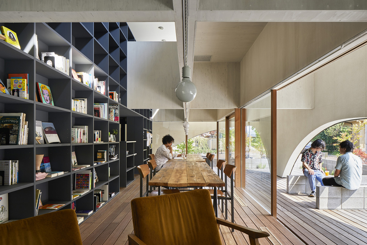 A dental clinic and daycare center are hidden under arches in Japan by Takeru Shoji Architects