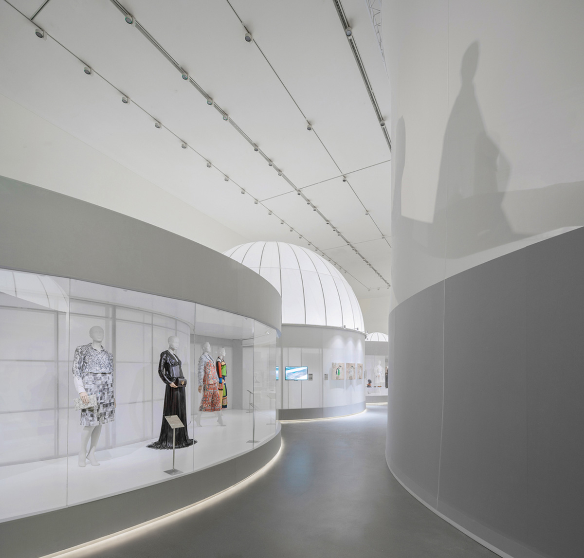 Studio 10 designs exhibition space with white tubular structures and black translucent ramps in China