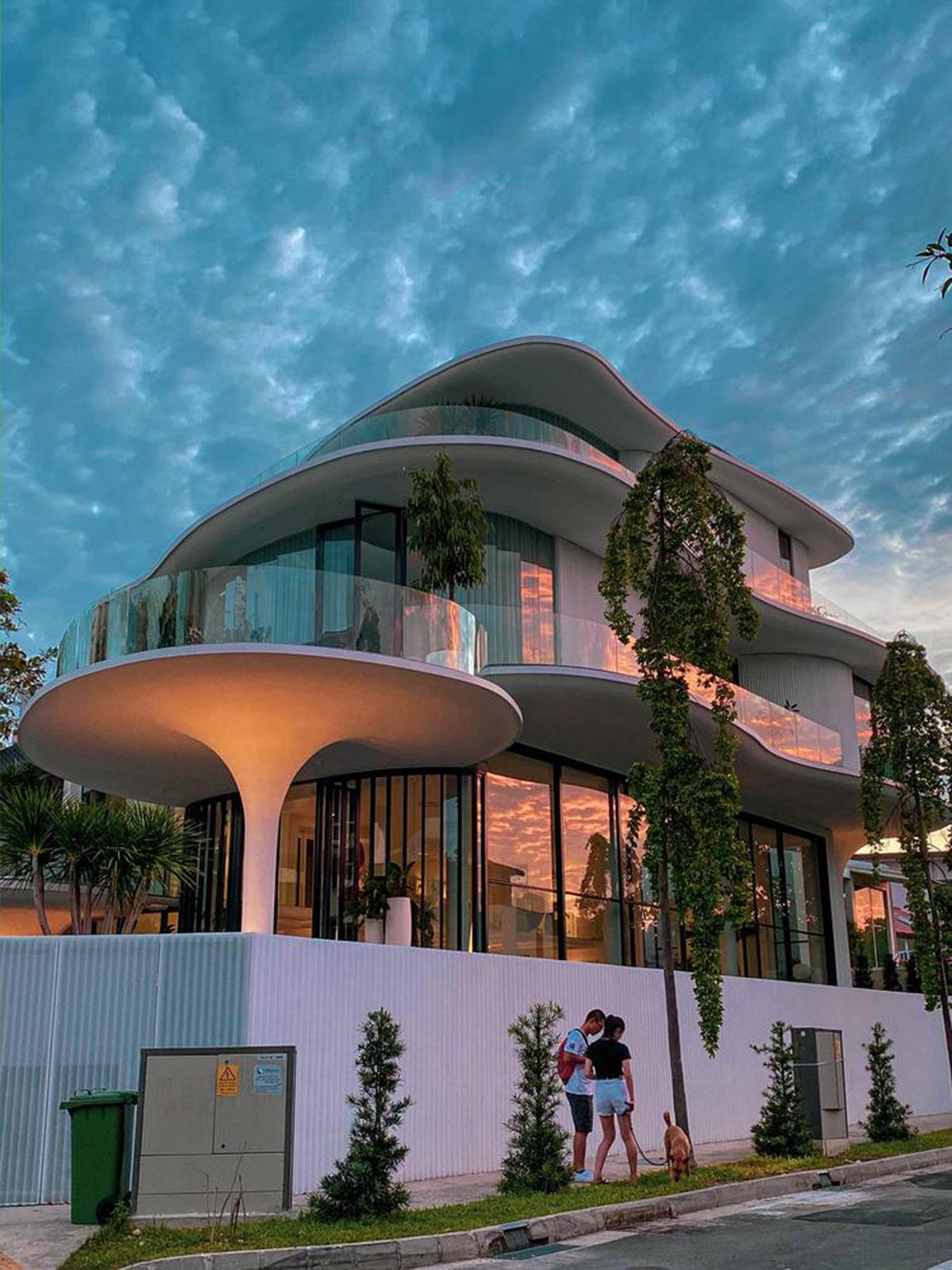 EHKA Studio's curvaceous residence features floating pods offering playful facade in Singapore