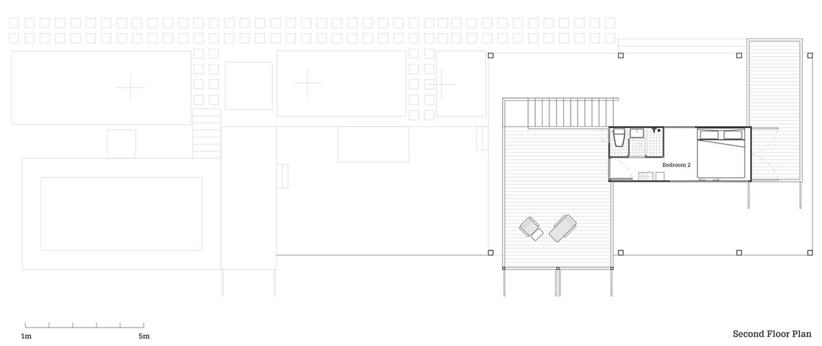 Disused shipping containers form a holiday home under A-frame roof by Tung Jai Ork Baab